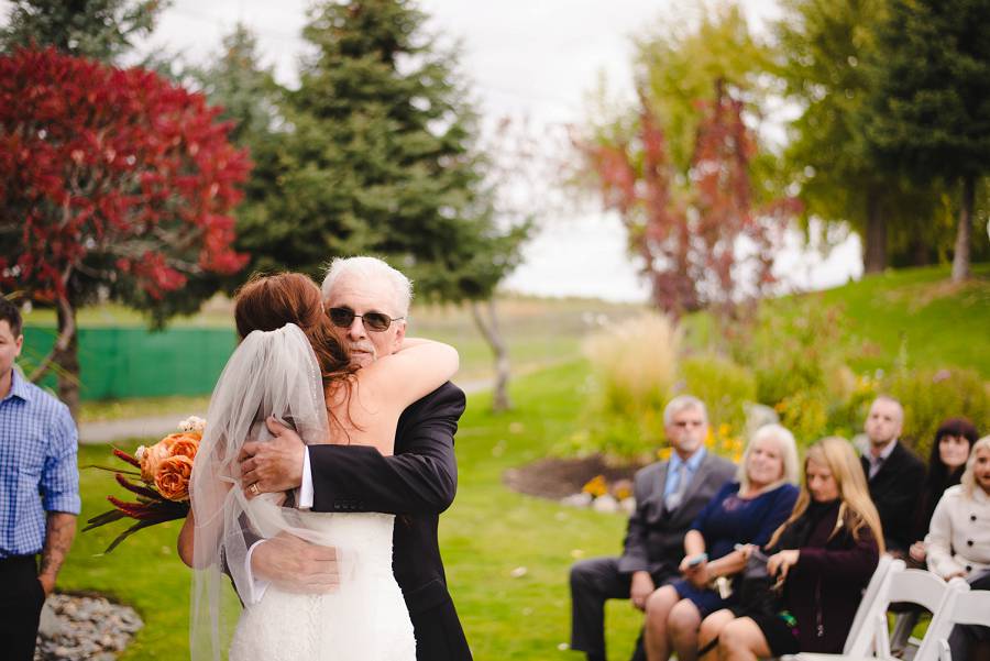 bride hugging her father at Sunset Ranch
