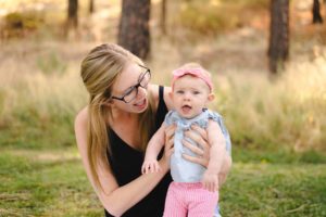 Kelowna photographer, Kristine Brevik smiling with her daughter