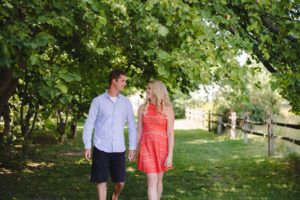 Engaged couple walking in a nut farm, Gellatly Nut Farm
