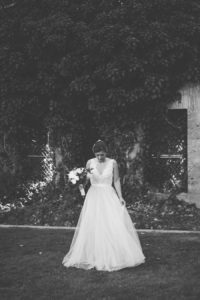 bride looking at her wedding dress
