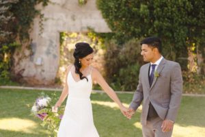 bride and groom walking in kelowna