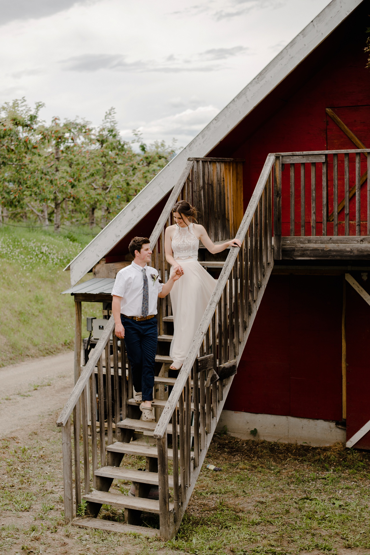 Bride and groom in front of a barn at Sproule's Farm, Lake Country
